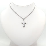 Twisted Cross with diamonds Accent Pendant